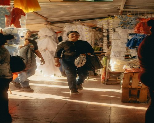 people walking in a vibrant mexican local market